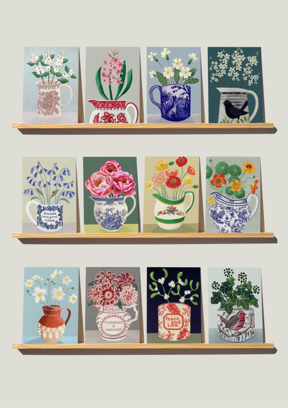 Shelves with decorative cards featuring floral designs and mugs on a light gray background